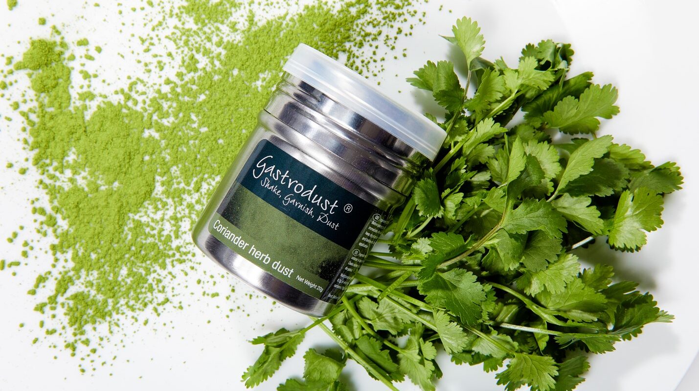 tub of coriander gastrodust with fresh coriander
